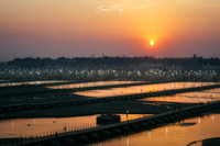 Sunset Farewell to Kumbh Mela India lights warm reflection river Gange