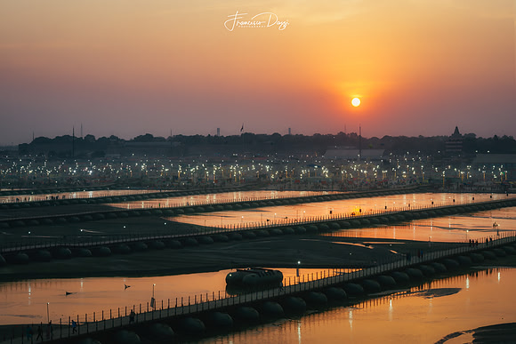 Sunset Farewell to Kumbh Mela India lights warm reflection river Gange