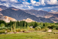 View of Thiksey gompa through the Indus valley landscape India Ladakh