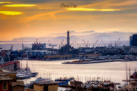 The Port of Genoa and the lighthouse at sunset landscape Italy
