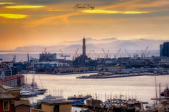 The Port of Genoa and the lighthouse at sunset landscape Italy