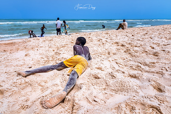 Relaxing moments by the sea in Senegal boy beach relax play