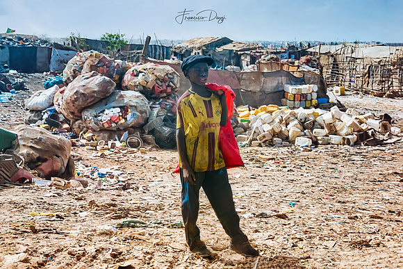 Senegal Dakar bulldozer landfill Mbeubeuss people workers garbage